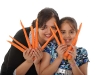 woman_girl_peeking_carrots